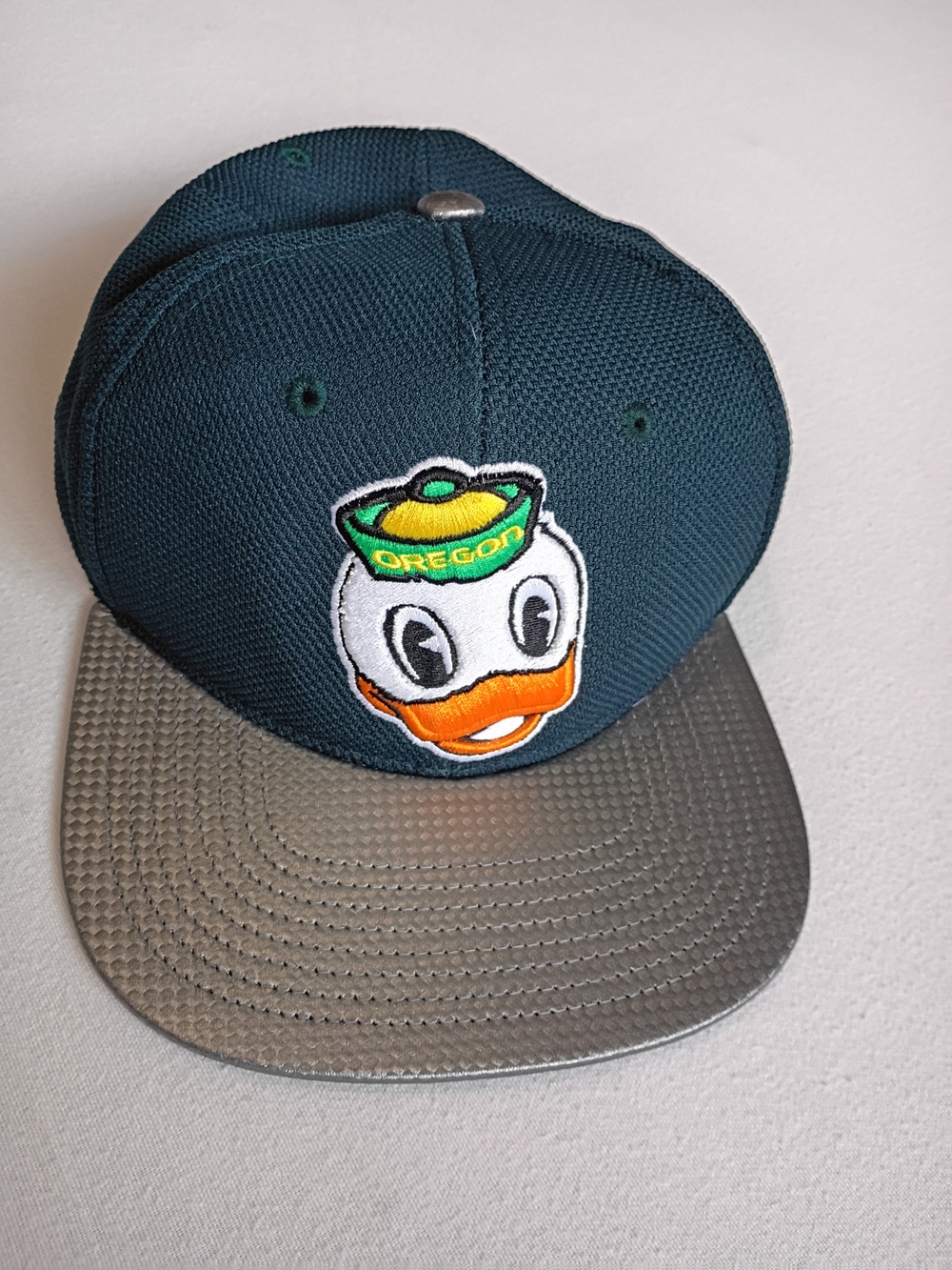 Zephyr Dark Green Embroidered Oregon Ducks snapback hat featuring Puddles Mascot